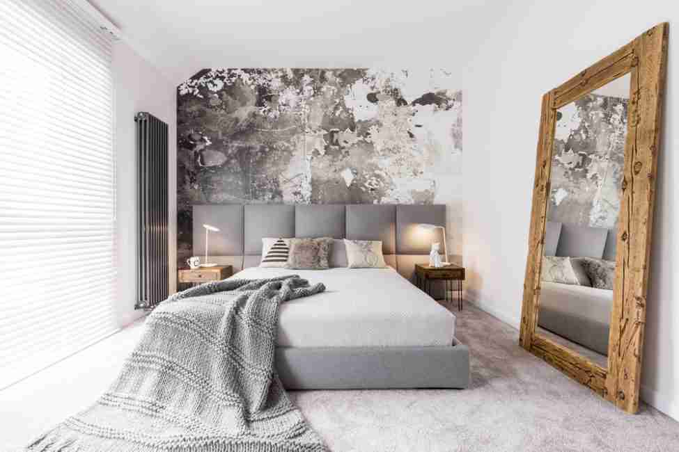 Los tonos grises se mezclan en perfecta armonia con el blanco y la madera